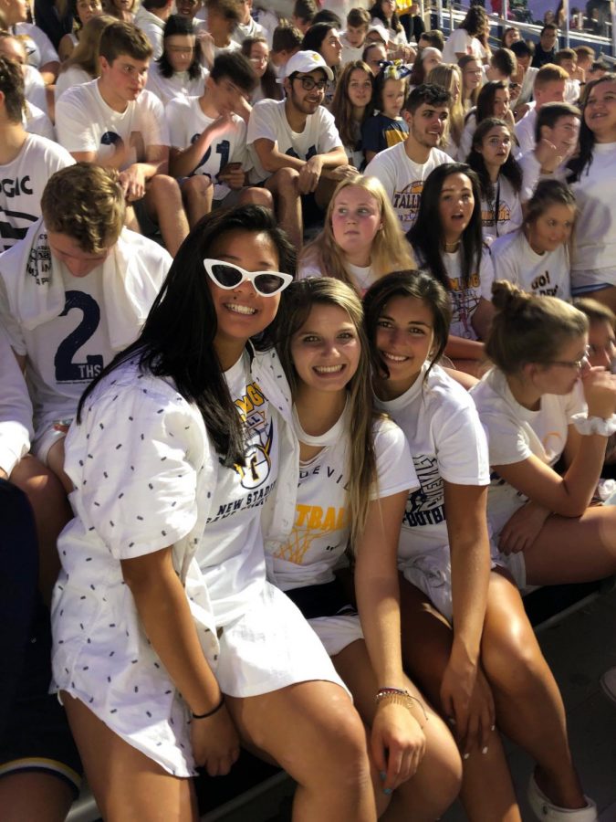 Murphy poses with her friends at the White out football game.