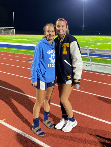 The Caruso sisters, freshman Abby (left) and senior Halle (right), pose for a picture together. 